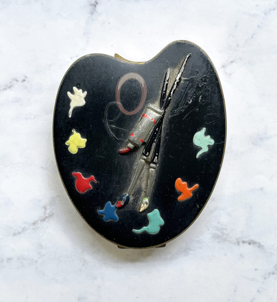 Vintage black enameled  compact shaped like a  painter's palette